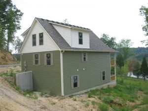 using landscape; build into slope; daylight basement; built into hill